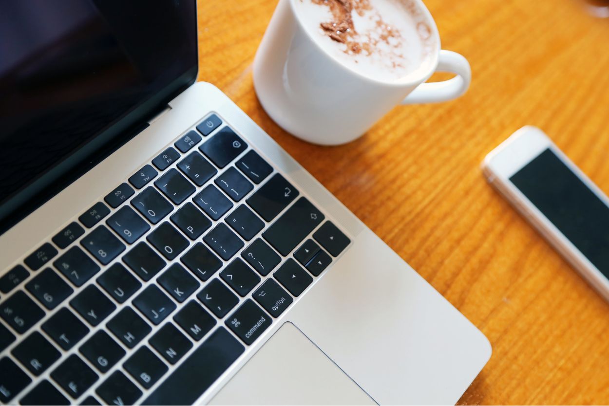 computer keyboard with coffee cup