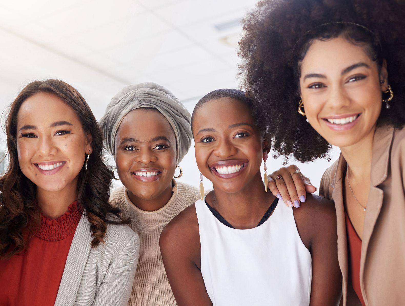 four women smiling